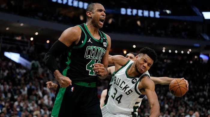 Boston Celtics’ Al Horford reacts in front of Milwaukee Bucks’ Giannis Antetokounmpo during the second half of Game 4 of an NBA basketball Eastern Conference semifinals playoff series Monday, May 9, 2022, in Milwaukee. The Celtics won 116-108 to tie the series 2-2.